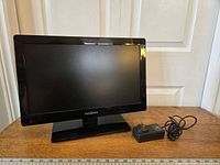 Front view of Insignia 18-inch TV with power adapter