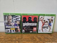 Front view of all three Xbox One game cases standing side by side