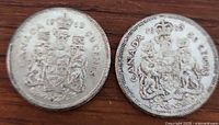 Two Canadian 1963 silver half dollar coins showing obverse side with coat of arms and denomination.