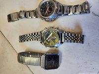 All three watches laid out showing overall condition and style