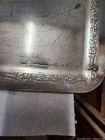 signature and corner motif on tray