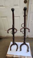Both harness stands full view showing height, brass knobs and horseshoe bases