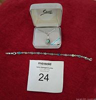 Necklace in Storrs box and bracelet laid below
