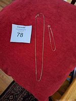 Necklace and bracelet displayed together with lot number