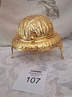 Closed dome caviar server on tripod feet