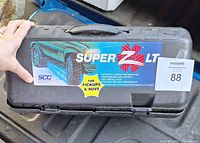 Front of black case showing Super Z LT label and handle