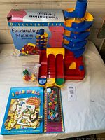 Full view of assembled Fascination Station set, original box, I Can Spell book, letter tiles, bag of balls