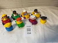 Group of eight Fisher-Price Little People cars with figures