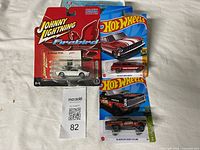 Front view of all three sealed die-cast cars on cards