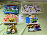 Overall lot showing three LeapFrog boards and magnets