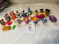 All figures, animals and accessories grouped on table