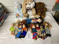 Group shot of eight Ty Teenie Beanie Bopper dolls and three plush animals