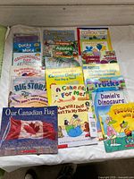 Full set of fifteen children’s books spread on table