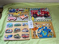 All four wooden puzzles laid out showing fronts and pieces