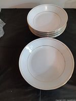 Stack and single bowl showing gold-trim rim