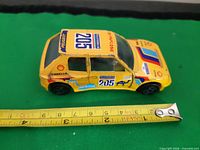 Top and side view with tape measure showing length