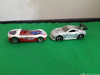 Side view of both diecast cars