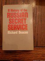 Front cover with dust jacket showing title and author