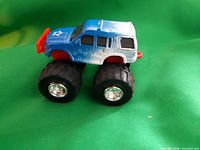 Right side view of blue monster truck toy