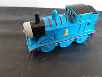 Left side view of Thomas engine showing number 1, wheels, body details