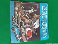 Front of picture sleeve showing gremlin artwork and title