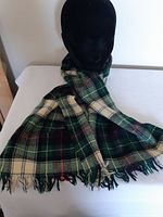 Full view of scarf draped to show length, pattern and fringe