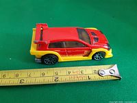 Left side view with ruler showing length