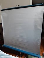 Full view of projector screen surface with blue casings
