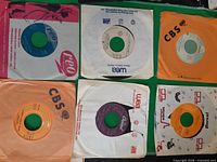 All six 45 rpm singles laid out with sleeves visible