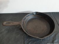 Top view showing interior surface, handle, and pour spout