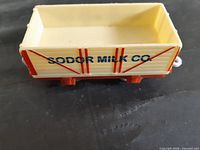 Side view showing Sodor Milk Co. lettering and overall condition
