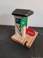 Front angled view of wooden Stop & Go Station showing GO and STOP signs