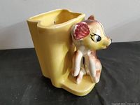 Front angled view showing deer figure and planter pocket