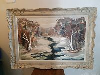 Front view of framed landscape painting