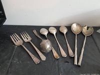 Group shot of all eight utensils on table