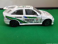 Side view of white Yacco Durango Ford Escort RS Cosworth diecast car