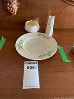 Plate, bud vase and footed bowl displayed together