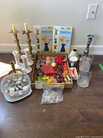 overview of entire lot showing candlesticks, candles, holders and accessories
