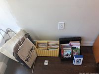Lot overview showing shopping bags, striped box of cards, wooden trunk of cards, blue boxed set
