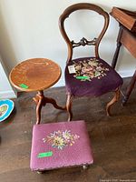 Overall view of chair, footstool and table