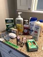 Overview of all unopened personal care items on countertop
