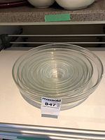 Full nested stack of clear glass mixing bowls