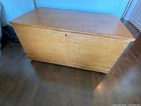 Closed wooden trunk showing exterior finish and wear