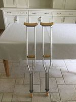 Full view of both crutches standing side by side