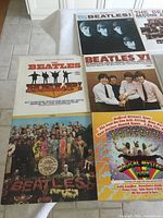Six album covers including Meet The Beatles! and Sgt. Pepper