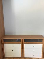 Front view of 8-drawer dresser showing beech and cream finish with frosted glass top drawers