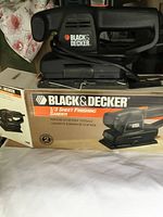 Black & Decker 1/3 sheet finishing sander on its original box