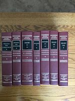 Seven hardcover English Monarchs volumes spine view