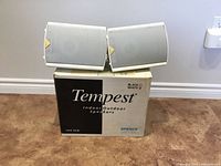 Front view of both Energy Tempest speakers on original box