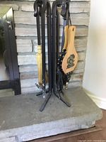 Tool stand with bellows, broom, poker, shovel